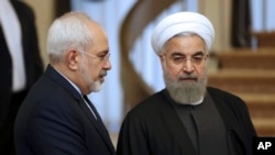 Presiden Iran Hassan Rouhani (kanan) bersama Menlu Iran Mohammad Javad Zarif (Foto: dok).