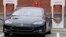 FILE - A Telsa car recharges at a Tesla charging station in Charlotte, North Carolina, June 24, 2017. 