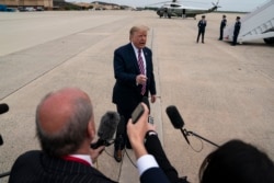President Donald Trump talks to reporters before boarding Air Force One for a trip to Phoenix to visit a Honeywell plant that manufactures protective equipment, in Andrews Air Force Base, Md., May 5, 2020.