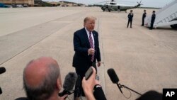 President Donald Trump talks to reporters May 5, 2020, at Andrews Air Force Base in Maryland.