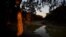 A gum tree glows as the sun sets over what is left of the Darling River in Menindee, Australia, Sept. 29, 2019. Reduced to a string of stagnant mustard-colored pools, fouled with pesticide runoff and rotting carcasses, the river is running dry.