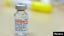 FILE - The drug Naloxone sits on a table during a free Opioid Overdose Prevention Training class provided by Lourdes Hospital in Binghamton, New York, U.S.