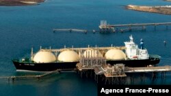 FILE - A 2012 photo shows Woodside Energy Ltd's LNG (liquefied natural gas) tanker at the Karratha gas plant loading terminal in the north of Western Australia. (AFP photo/ HO / Woodside Energy LTD)