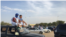 Supporters of opposition candidate Mohamed Ould Mouloud sit on their car for a better view of his final campaign rally (E. Sarai/VOA) 