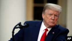 President Donald Trump listens to a question in the Rose Garden of the White House, April 27, 2020, in Washington. 