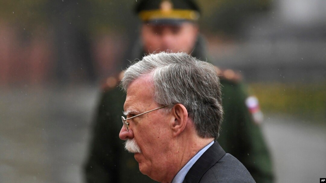 U.S. National Security Adviser John Bolton attends a wreath laying ceremony at the Tomb of the Unknown Soldier by the Kremlin wall in Moscow, Russia, Tuesday, Oct. 23, 2018. U.S. President Donald Trump's national security adviser Bolton struck a conciliatory note Tuesday in talks in Moscow, just days after Trump vowed to pull out of a key arms control treaty with Russia. (Kirill Kudryavtsev/Pool Photo via AP)