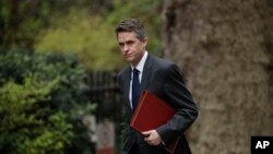 FILE - Britain's Defense Secretary Gavin Williamson, who was fired Wednesday, arrives for a cabinet meeting in 10 Downing Street, London, April 2, 2019. 