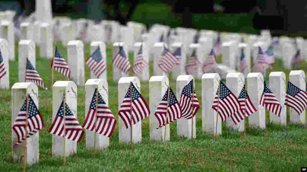 American flags are displayed next to veterans&#39; graves ahead of Memorial Day at the Crown Hill National Cemetery in Indianapolis, Indiana, May 29, 2021.