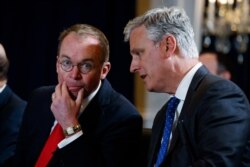 FILE - National Security Adviser Robert C. O'Brien, right, talks with White House chief of staff Mick Mulvaney during a meeting in New York, Sept. 23, 2019.