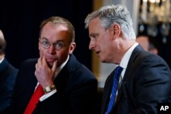 FILE - National Security Adviser Robert C. O'Brien, right, talks with White House chief of staff Mick Mulvaney during a meeting in New York, Sept. 23, 2019.