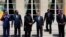 French President Francois Hollande, third right, shakes hands with Nigeria President Goodluck Jonathan, third left, as others, from left, Niger's President Mahamadou Issoufou, Chad's President Idriss Debi, Cameroon President Paul Biya, Benin president Tho