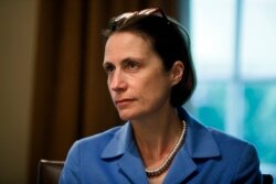 FILE - Fiona Hill, a former official of the National Security Council specializing in the former Soviet Union and Russian and European affairs, is pictured at a White House meeting, April 2, 2019, in Washington.
