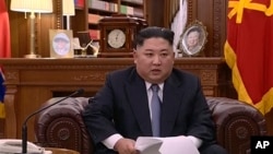 In this undated image from video distributed on Jan. 1, 2019, by North Korean broadcaster KRT, North Korean leader Kim Jong Un delivers a speech in North Korea.