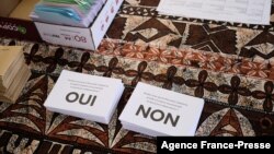 This Dec. 12, 2021, photo hows ballots reading 'Yes' and 'No' for the referendum on independence at a polling station of the City Hall in Noumea, New Caledonia. 