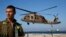 An Israeli air force black hawk helicopter carrying two wounded Israeli soldiers comes in to land at a hospital in the northern city of Haifa, Oct. 7, 2014. 