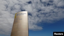 FILE PHOTO: The logo of state power utility Eskom is seen outside Cape Town's Koeberg nuclear power plant