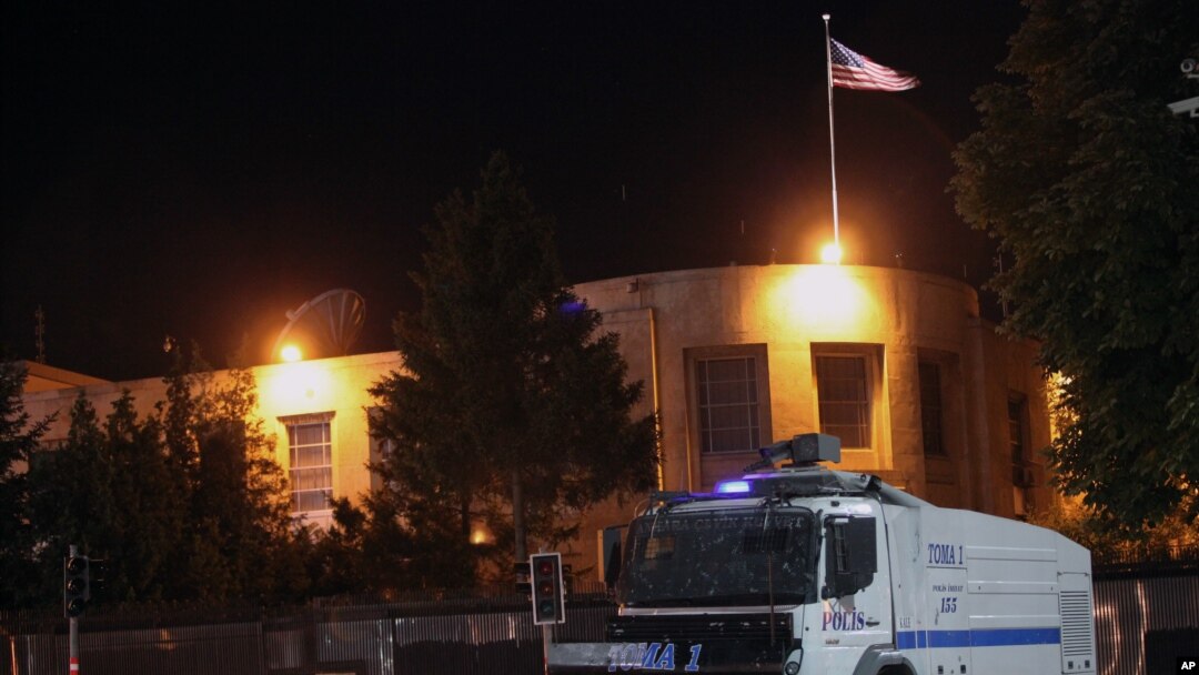 FILE - A police vehicle is seen in front of the U.S. Embassy in Ankara, Turkey, June 22, 2013.