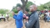 Obey Shava, (blue suit)Zimbabwe Lawyers for Human Rights