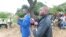 Obey Shava, (blue suit)Zimbabwe Lawyers for Human Rights