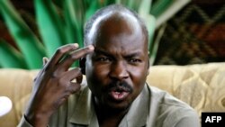 FILE - Ahmed Harun, who then was South Kordofan governor, gestures during a press conference in Talodi, Sudan, April 12, 2012. On April 20, 2019, Harun was one of several leaders of the former ruling National Congress Party who were arrested, a senior party official said.