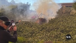 Father and son refuse to leave their LA home despite fires 