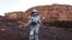 A scientist holds a drone as he participates in a demonstration of an experiment led by Austrian and Israeli agencies simulating a mission to Mars near Mitzpe Ramon, Israel, Oct. 10, 2021.
