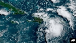 Foto satelit ketika badai tropis Fred melewati Puerto Rico dan Republik Dominika hari Rabu pagi (11/8). 