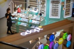 An employee dusts merchandise at a jewelry store in a shopping mall in Beijing, Oct. 31, 2019. Chinese leaders are counting on consumers to power the economy, replacing trade and investment as Beijing fights a tariff war with the U.S.…