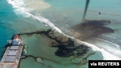 FILE - A general view shows the bulk carrier ship MV Wakashio that ran aground on a reef, at Riviere des Creoles, Mauritius, in this handout image obtained by Reuters Aug. 11, 2020. (French Army command/handout via Reuters) 