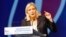 FILE - The National Front's Marine Le Pen, shown delivering a speech in Marseille, France, in September, would lose a runoff in the northern region of Nord-Pas-de-Calais-Picardie, a poll shows.
