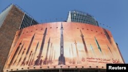 FILE - An anti-Israel billboard with a picture of Iranian missiles is seen on a street in Tehran, Iran April 19, 2024. (Majid Asgaripour/WANA, West Asia News Agency, via REUTERS)