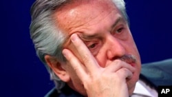 Argentina's President Alberto Fernandez waits to speak during the UN Climate Change Conference COP26 in Glasgow, Scotland, Nov. 2, 2021.