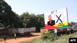 Presidential election campaign posters are seen on a billboard in Bissau, November 8, 2019. (Photo by - / AFP)