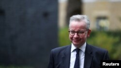 FILE - Britain's Chancellor of the Duchy of Lancaster Michael Gove arrives for a Cabinet meeting, in London, Oct. 13, 2020. (Reuters) 