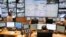 FILE - Police officers work at Paris Prefecture control room, in Paris, Nov. 10, 2016. 