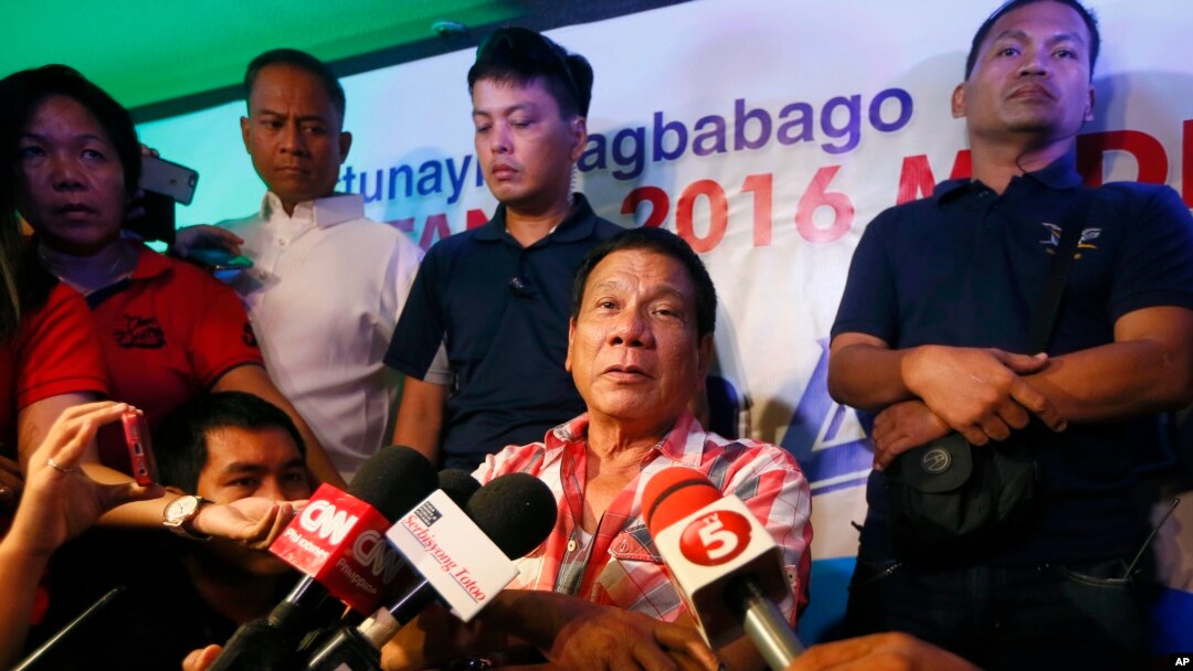 Front-running presidential candidate Mayor Rodrigo Duterte is interviewed by the media shortly after voting in a polling precinct at Daniel R. Aguinaldo National High School, Matina district, his hometown in Davao city in southern Philippines, May 9, 2016