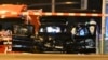 Forensic technicians work on a damaged car sitting with its doors open after a driver plowed into a busy Christmas market in Magdeburg, Germany, Dec. 21, 2024.