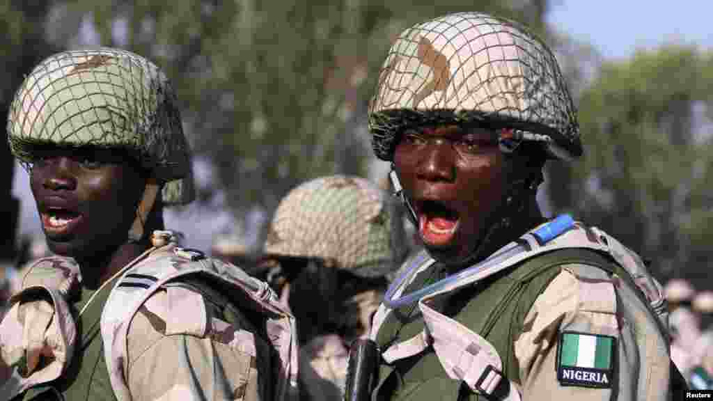 Nigerian soldiers gather during preparations for their deployment to Mali, at the army&#39;s peacekeeping centre in Kaduna.