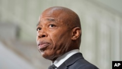 FILE - New York City Mayor Eric Adams speaks to reporters at a news conference in New York, Sept. 16, 2024.