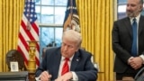Trump sign executive order in oval office. White House. File.