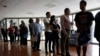 FILE - People stand in line to register for a job fair in Miami Lakes, Florida, July 19, 2016.