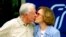FILE — Former US president Jimmy Carter receives a kiss from his wife Rosalynn Carter after a press conference in Plains, Georgia, on October 11, 2002