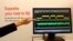 An exhibitor points to a screen displaying 5G spectrums during the Mobile World Congress in Barcelona March 5, 2015.