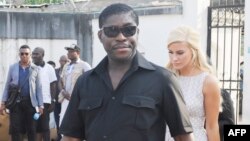 Teodorin Obiang Nguema et sa compagne danoise Christina D. Mikkelsen, miss Bride of the World 2012, à Malabo, le 23 décembre 2014.