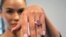 FILE: Model Paula Nissen wears a 10.57-carat purplish-pink diamond called Eternal Pink in New York City on Tuesday, March 28, 2023. Sotheby's auction house estimates the diamond will sell for over $35 million in June. 