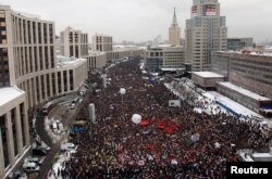 FILE - Demonstrators gather to protest recent parliamentary election results in Moscow, Dec. 24, 2011.