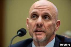 FILE - Stephen Hahn, commissioner for food and drugs in the Food and Drug Administration, testifies before a House subcommittee hearing on Health and Human Services oversight of the coronavirus outbreak, in Washington, Feb. 26, 2020.