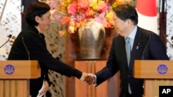 New Zealand Foreign Minister Nanaia Mahuta, left, and Japanese Foreign Minister Yoshimasa Hayashi, right, shake hands after a joint press conference, Feb. 27, 2023, in Tokyo.