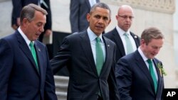 From left, House Speaker John Boehner of Ohio, President Barack Obama and Irish Prime Minister Enda Kenny leave a "Friends of Ireland" luncheon on Capitol Hill in Washington, March 17, 2015. 