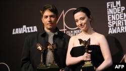 Sean Baker, left, stands with Mikey Madison at the Film Independent Spirit Awards 40th annual ceremony in Santa Monica, California, Feb. 22, 2025. Baker won best feature and best director for "Anora." Mikey Madison, who stars in the film, won best lead performer.